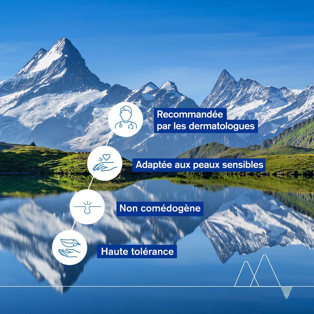 Paysage avec montagnes et lac. Texte: Recommandée par les dermatologues, Adaptée aux peaux sensibles.