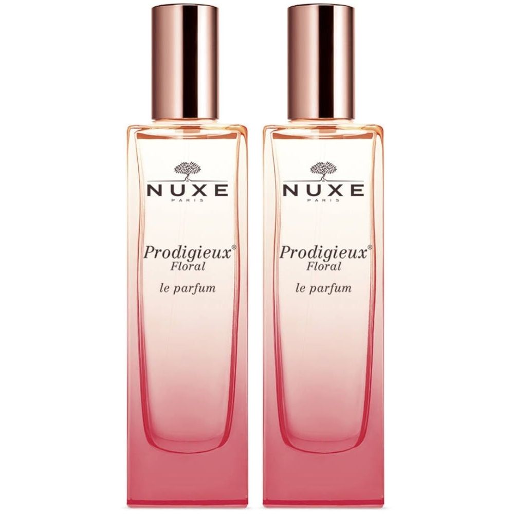 Deux flacons de NUXE Prodigieux Floral Le Parfum. Flacons en verre avec dégradé rose. Bouchons en or rose.