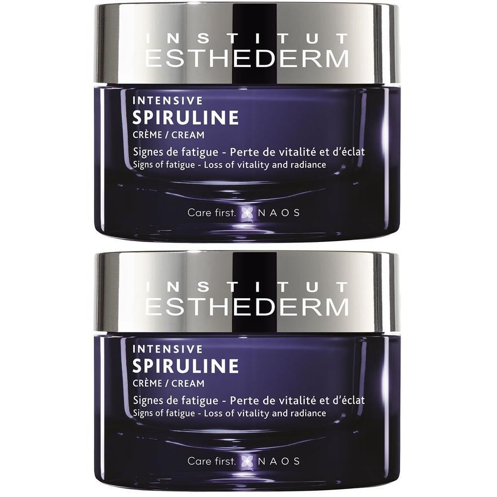 Deux pots de crème Institut Esthederm Intensive Spiruline. Pot bleu foncé avec couvercle argenté. Inscriptions.