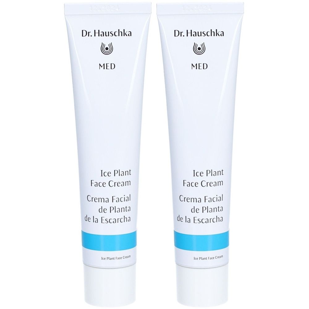 Deux tubes blancs avec texte. Inscription: Dr. Hauschka, MED, Ice Plant Face Cream, Crema Facial de Planta de la Escarcha. Bande bleue.