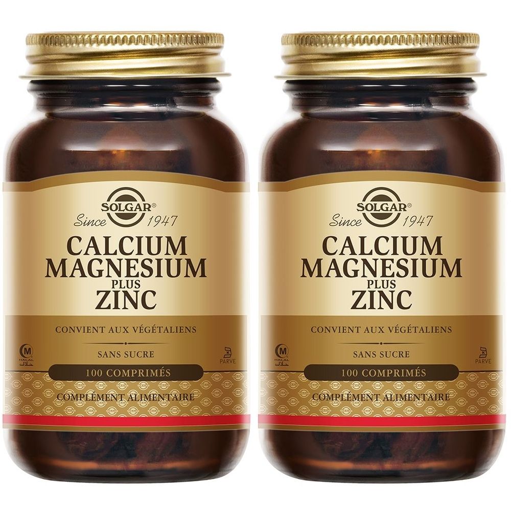 Deux flacons en verre brun avec des couvercles dorés. Étiquettes : "SOLGAR Calcium Magnésium Zinc". 100 comprimés, complément alimentaire.