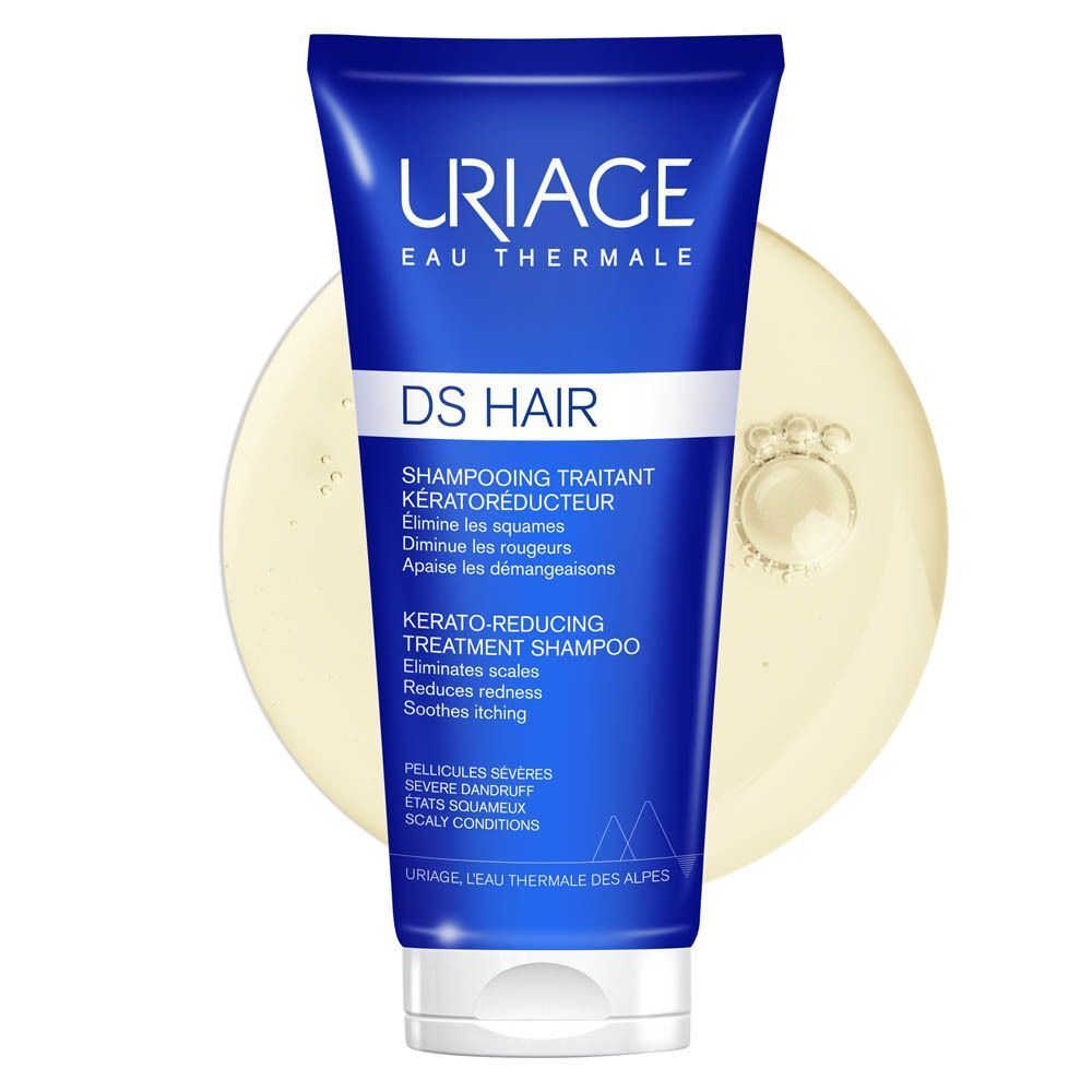 Un tube bleu de Uriage DS Hair Shampooing Traitant Kératoréducteur et un liquide jaune.