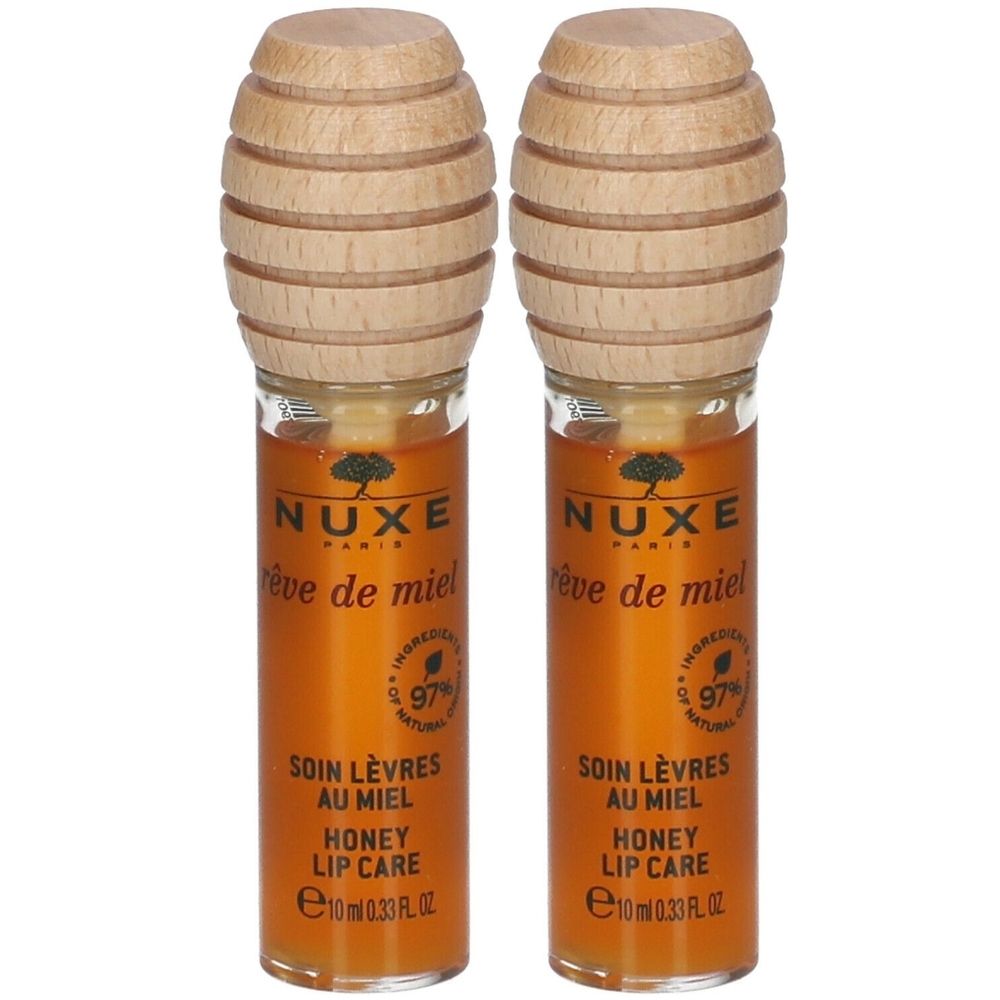Deux tubes de soin pour les lèvres avec bouchon en bois. Inscription: NUXE, Rêve de Miel, Soin Lèvres au Miel, Honey Lip Care. 97% ingrédients naturels.