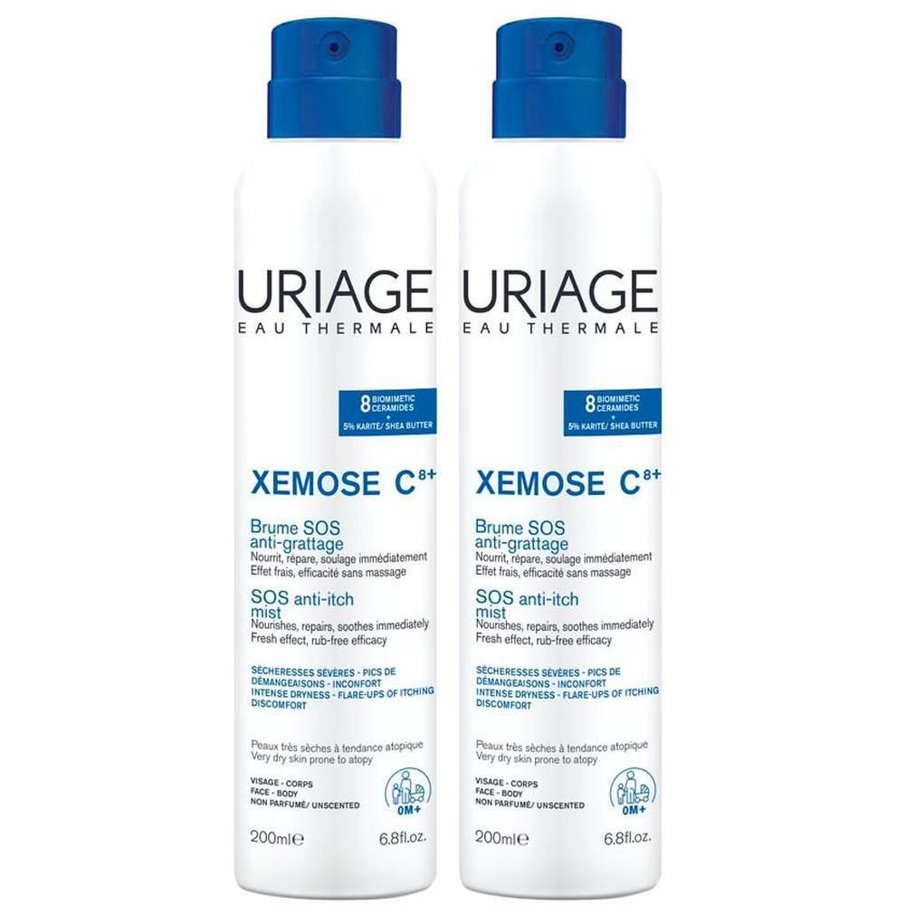 Deux sprays blancs avec bouchon bleu. Inscription: URIAGE, Xémose C+, Brume SOS anti-grattage.
