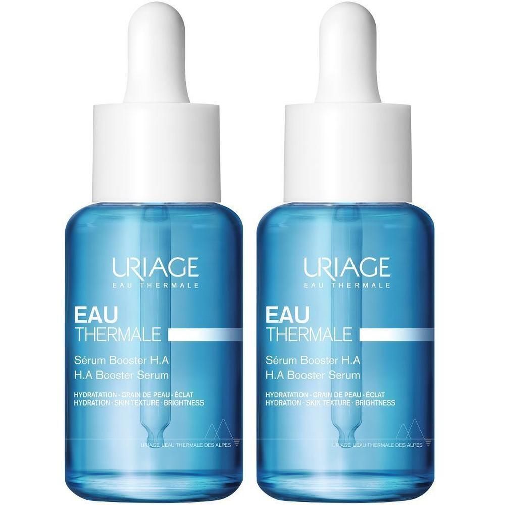 Deux flacons Uriage Sérum Booster H.A. Flacons en verre bleu avec bouchon blanc et pipette.