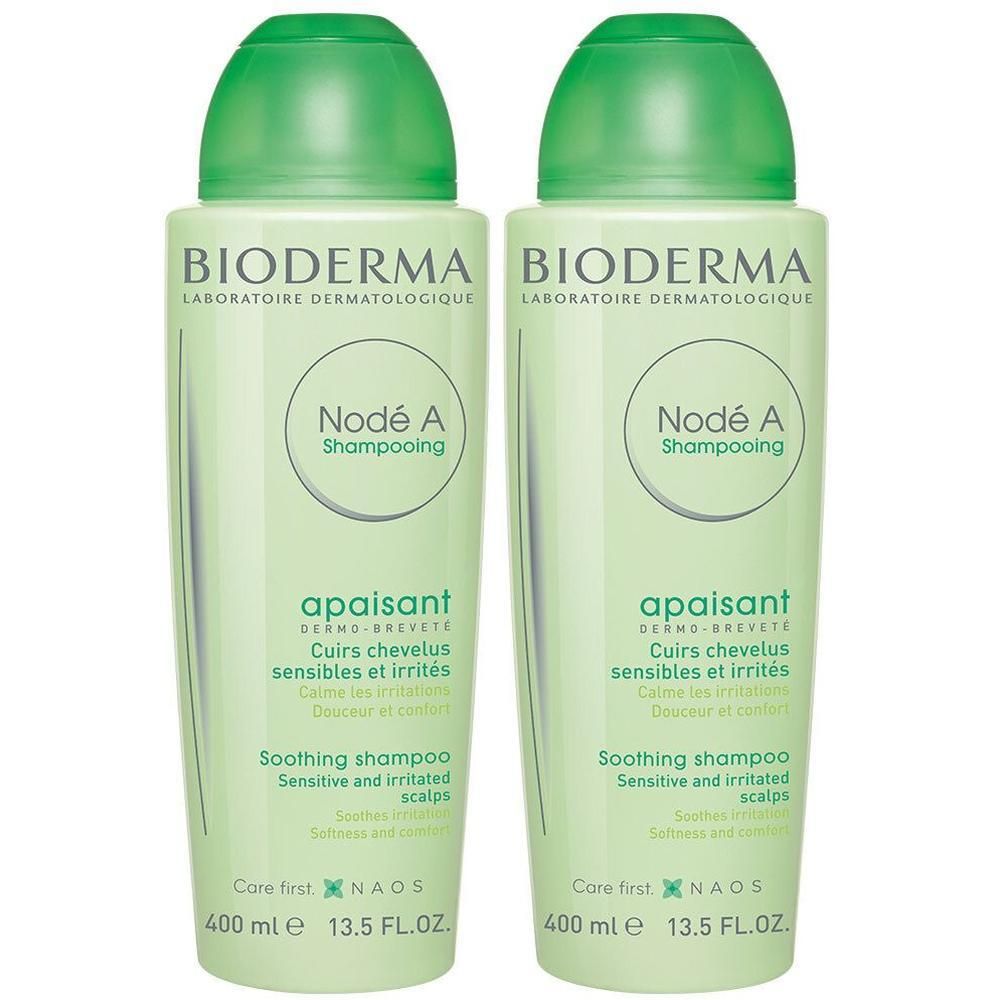 Deux flacons verts de shampooing BIODERMA Nodé A. Inscription : apaisant, pour cuirs chevelus sensibles. 400 ml.