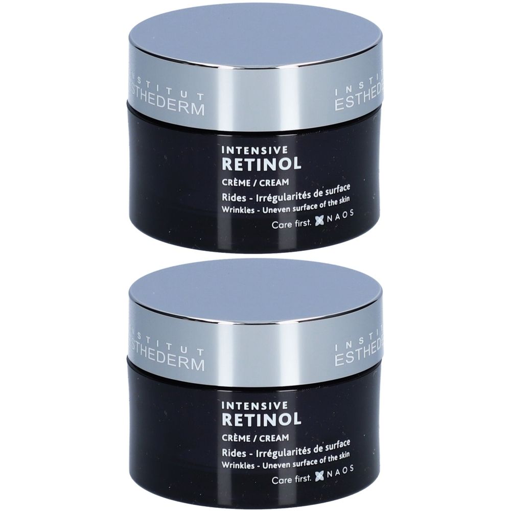 Deux pots noirs avec couvercles argentés. Inscription: Crème Intensive au Rétinol. Texte en français et en anglais. Marque: Institut Esthederm.