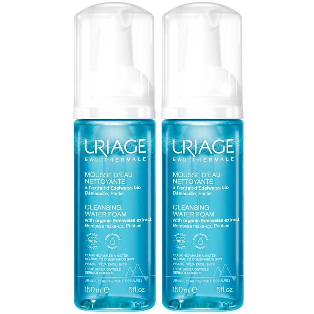 Deux flacons de Mousse d'eau nettoyante URIAGE. Flacons bleus avec vaporisateur blanc. Texte: Cleansing Water Foam.