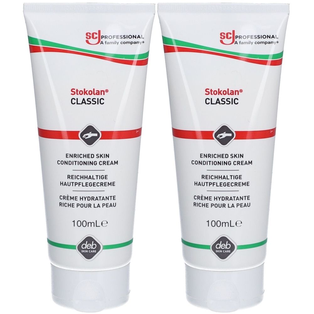 Deux tubes de crème Stokolan Classic. Tubes blancs avec texte rouge et vert. Texte: Enriched Skin Conditioning Cream.