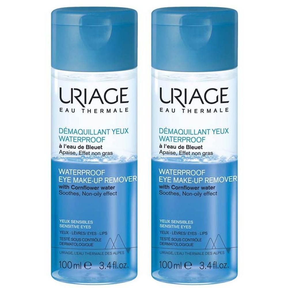 Deux flacons de démaquillant yeux Uriage. Flacons bleus avec bouchon bleu. Texte: Waterproof Eye Make-up Remover.
