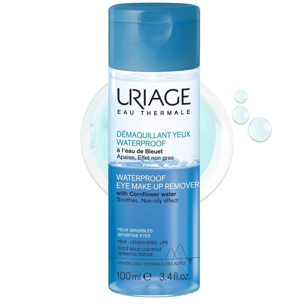 Un flacon de démaquillant yeux Uriage. Flacon bleu avec bouchon bleu. Texte: Waterproof Eye Make-up Remover.