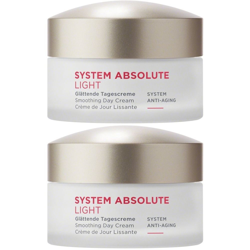 Deux pots avec couvercles. Inscription: SYSTEM ABSOLUTE LIGHT, Glättende Tagescreme, Smoothing Day Cream, Crème de Jour Lissante, SYSTEM ANTI-AGING.