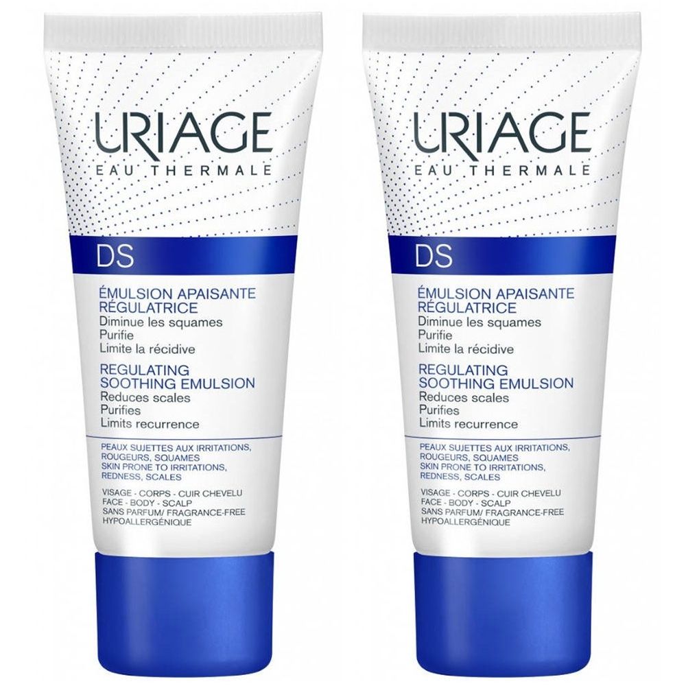 Deux tubes de URIAGE D.S Émulsion. Blanc avec texte bleu et bouchons bleus. Texte : « Émulsion Apaisante Régulatrice » et « Regulating Soothing Emulsion ».