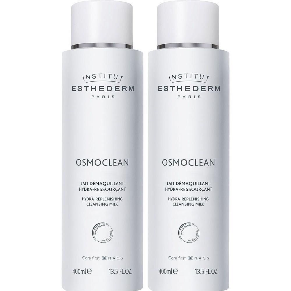 Deux flacons de lait démaquillant Hydra-Replenishing Osmoclean Institut Esthederm. Flacons blancs, bouchons argentés, étiquettes.