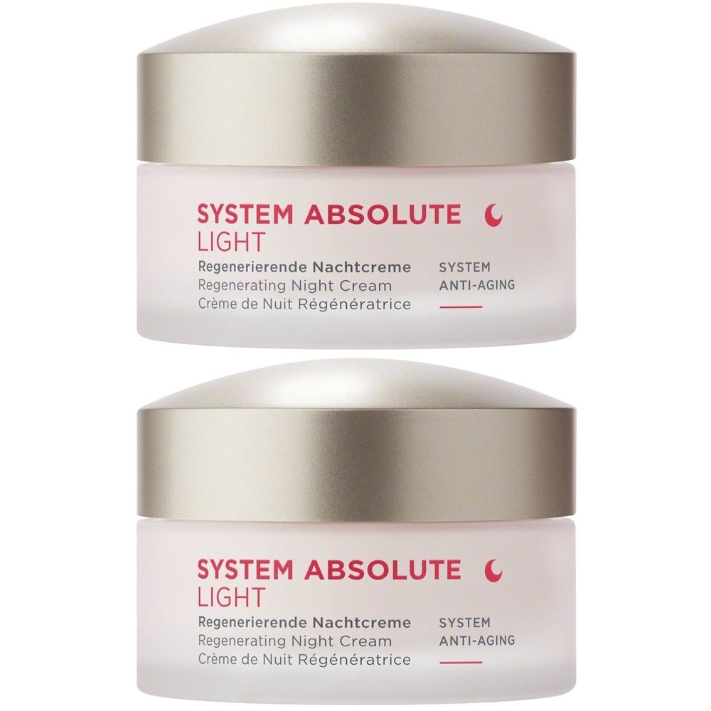 Deux pots de crème de nuit. Inscription : SYSTEM ABSOLUTE LIGHT. Texte en allemand, anglais et français. Couvercles dorés, pots roses.