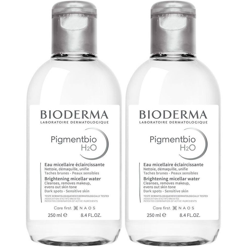 Deux flacons de Bioderma Pigmentbio H2O. Liquide clair dans des bouteilles transparentes avec des bouchons argentés. Étiquette avec informations.