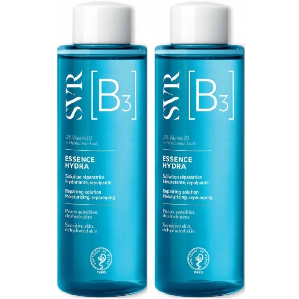 Deux flacons bleus avec bouchons blancs. Inscription SVR [B3] Essence Hydra. Texte : 2% Vitamine B3 + Acide Hyaluronique.