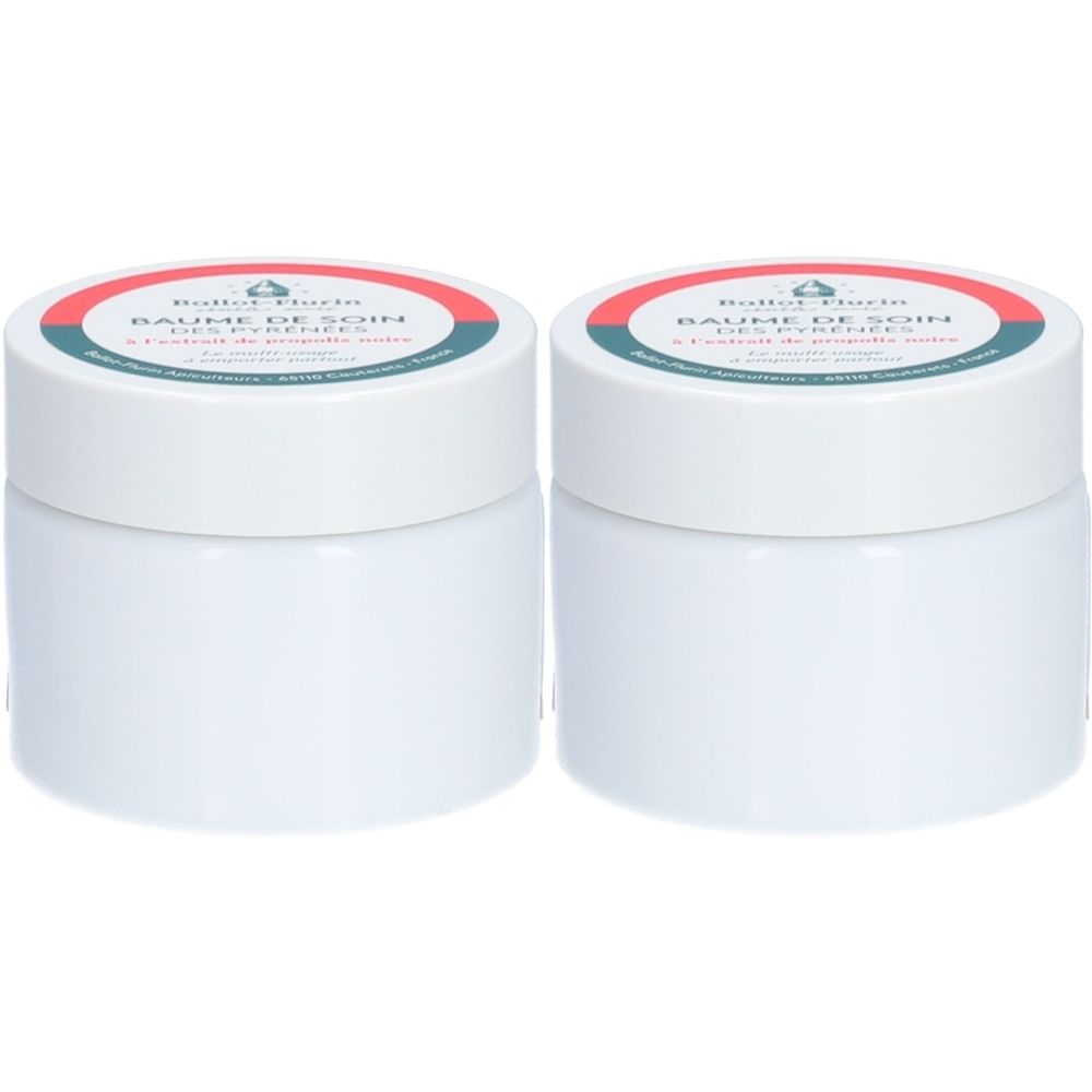 Deux pots blancs avec couvercles. Sur le couvercle, "BAUME DE SOIN" et le nom de la marque. Anneau rouge et vert sur le couvercle.