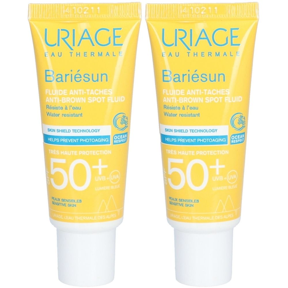 Deux tubes jaunes avec texte. Inscription: URIAGE Bariésun, Anti-Taches, SPF50+. Bouchon blanc. Texte en français.