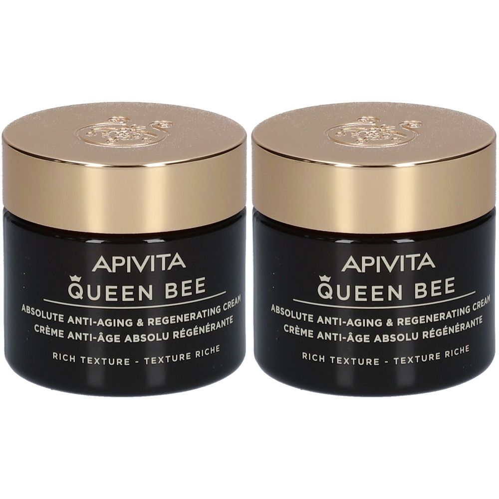 Deux pots de crème avec des couvercles dorés. Les étiquettes noires indiquent "APIVITA QUEEN BEE" et "ABSOLUTE ANTI-AGING & REGENERATING CREAM".