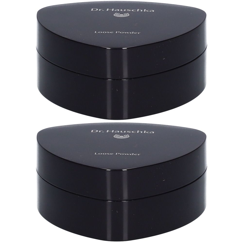 Deux boîtiers noirs triangulaires. Inscription: Dr. Hauschka, Loose Powder.