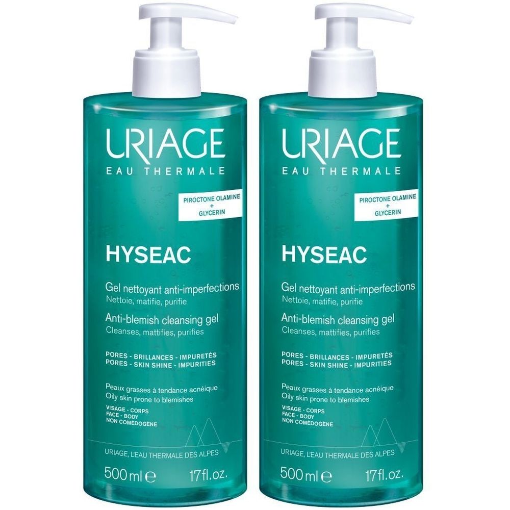 Deux flacons de gel nettoyant anti-imperfections Uriage Hyséac. Flacons turquoise avec pompe blanche. Texte: Anti-blemish cleansing gel, 500 ml.