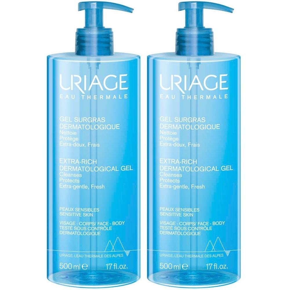 Deux flacons bleus de Gel Surgras Liquide dermatologique URIAGE avec pompe. Texte : Extra-Rich Dermatological Gel, 500 ml.