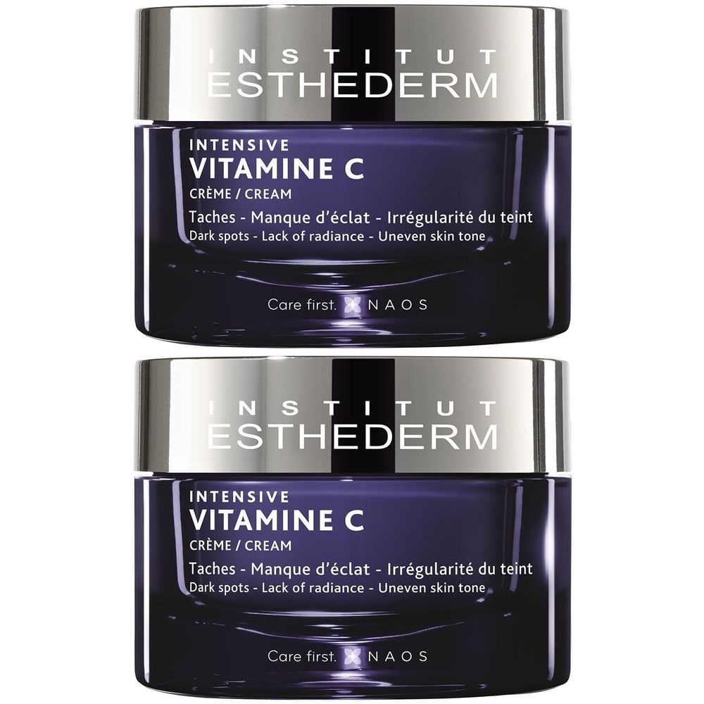 Deux pots INSTITUT ESTHEDERM Intensive Vitamine C. Pot bleu foncé avec couvercle argenté. Texte : Crème, contre les taches.