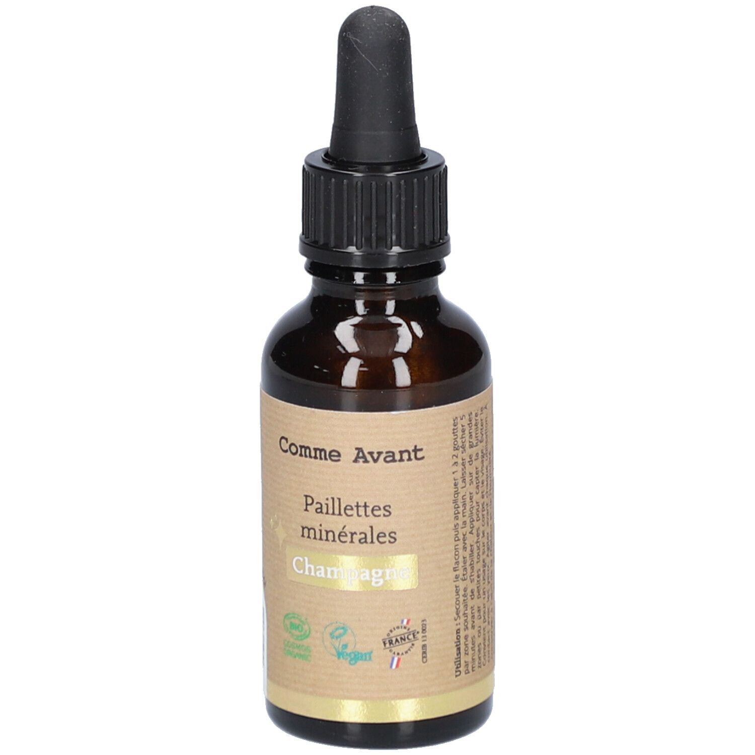 Flacon en verre brun avec compte-gouttes noir. Étiquette avec nom du produit et logo. Labels vegan et bio.