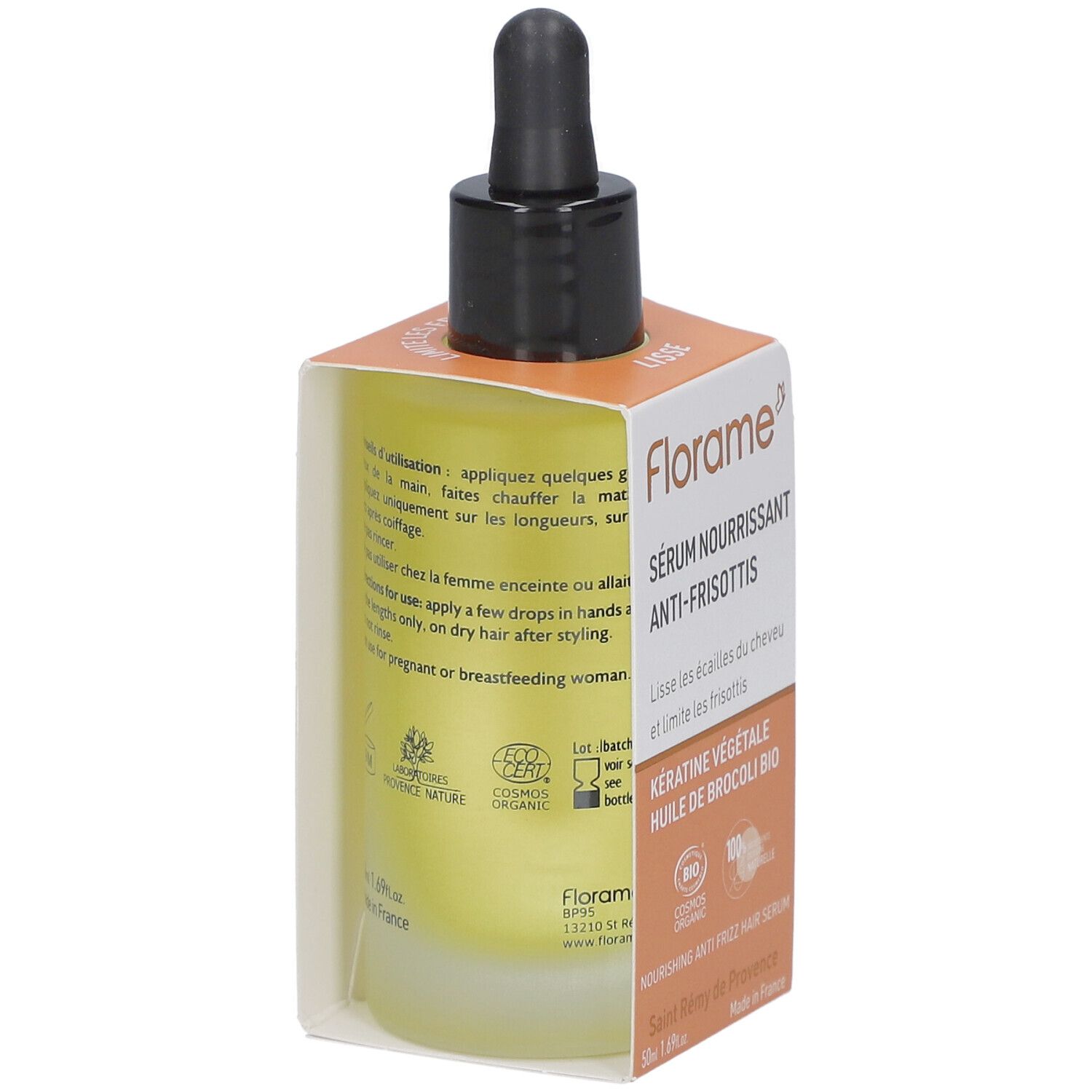 Vue arrière du flacon de sérum avec pipette noire dans une boîte orange. Texte sur le flacon et la boîte.