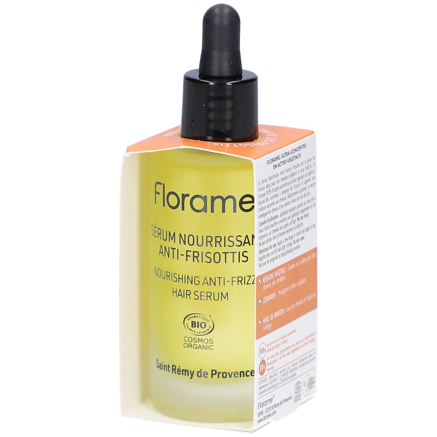 Flacon de sérum avec pipette noire dans une boîte orange. Texte sur le flacon et la boîte.