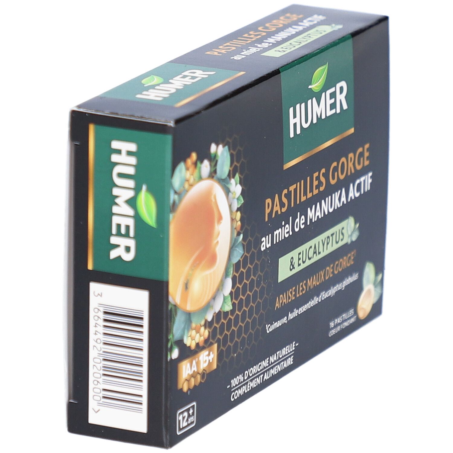Boîte HUMER Pastilles Gorge en biais. Fond noir, accents verts. Texte: Pastilles Gorge au miel de Manuka Actif & Eucalyptus. 12+.