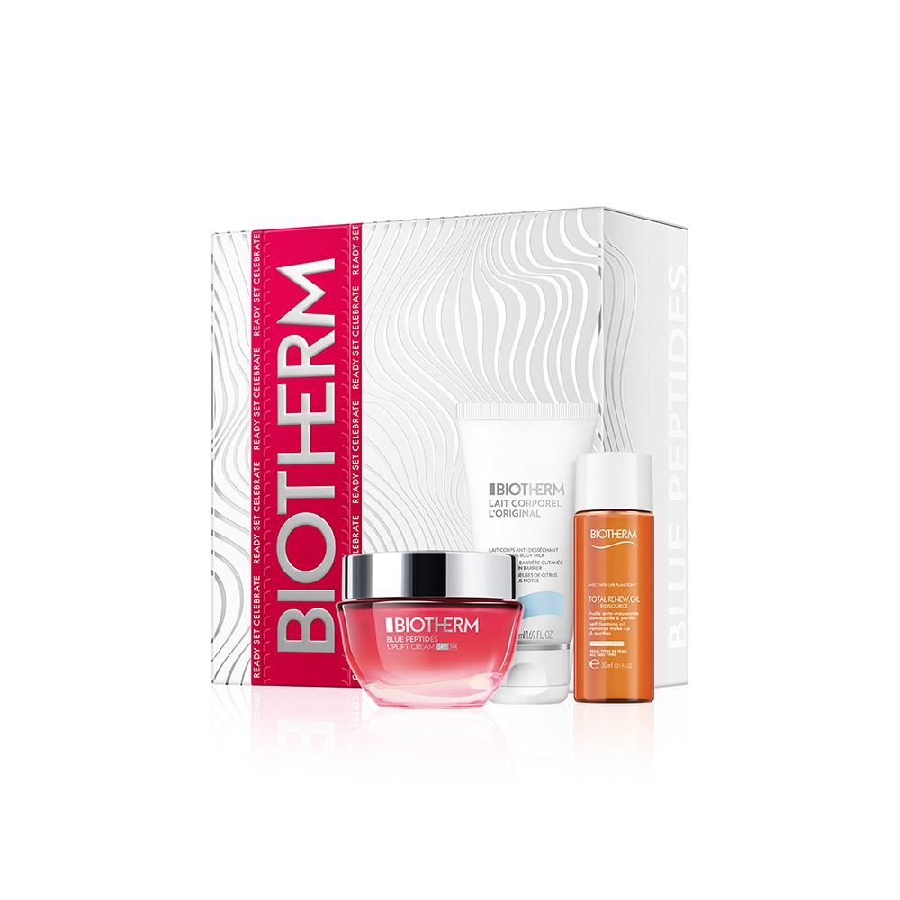 Coffret cadeau BIOTHERM avec crème, lotion et sérum. Logo et noms de produits visibles. Emballage à motifs ondulés.