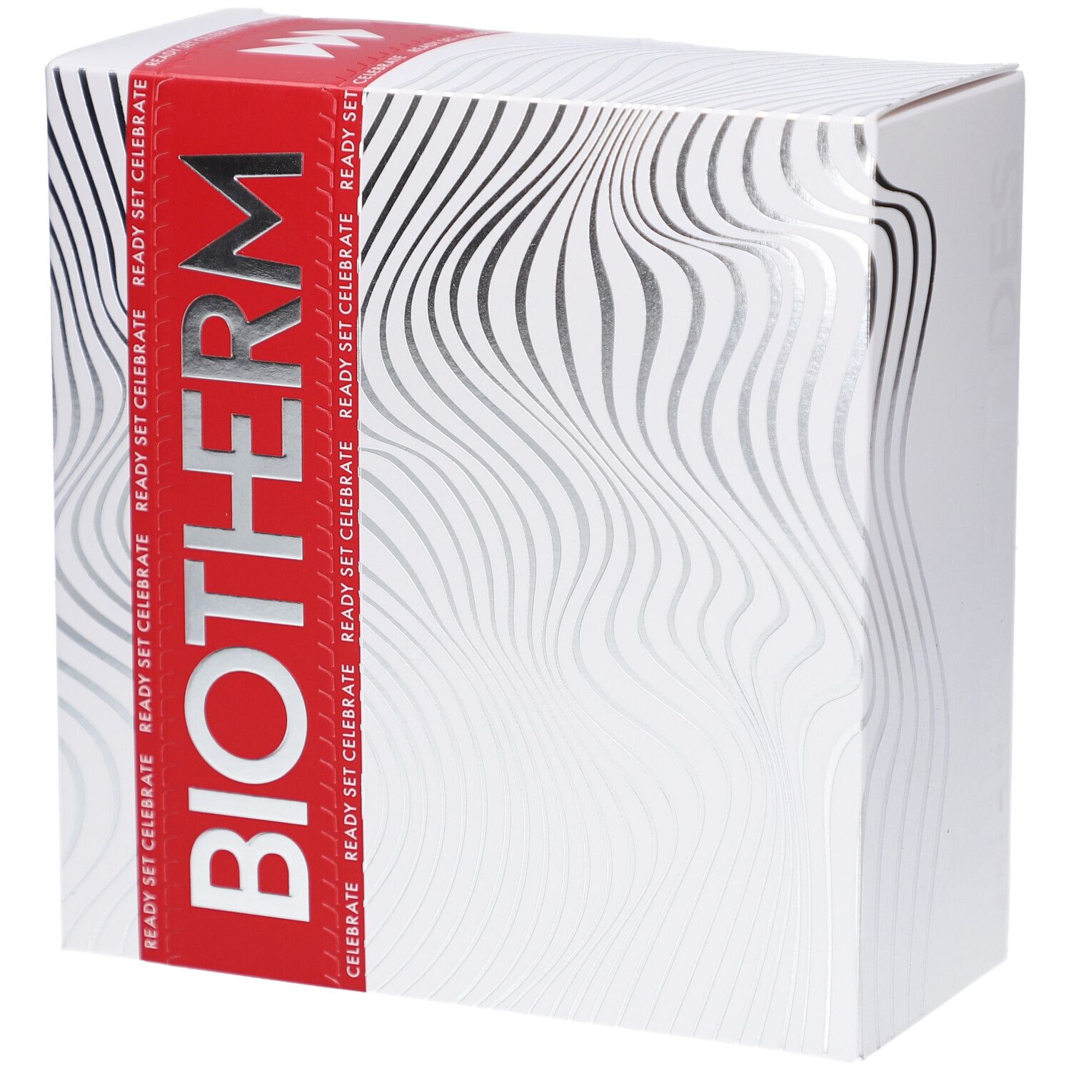 Boîte blanche avec logo BIOTHERM et texte READY SET CELEBRATE. Motifs ondulés argentés sur la surface.