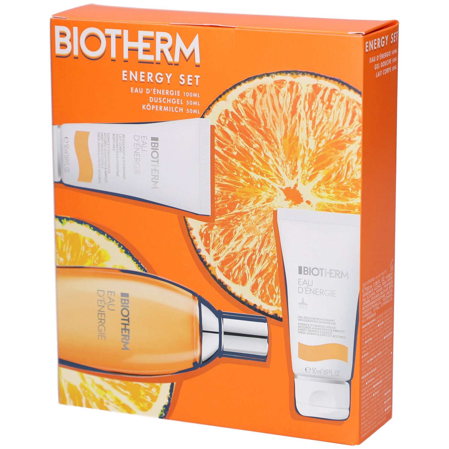 Coffret BIOTHERM avec Eau Energie, gel douche et lait corporel. Emballage orange avec décor d'oranges. Produits visibles.
