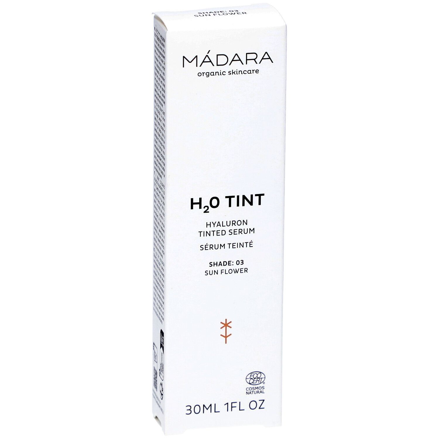Emballage blanc avec texte. Marque : MÁDARA. Produit : H2O TINT Hyaluron Tinted Serum. Teinte : 03 Sun Flower. 30ml/1FL OZ. Logo.