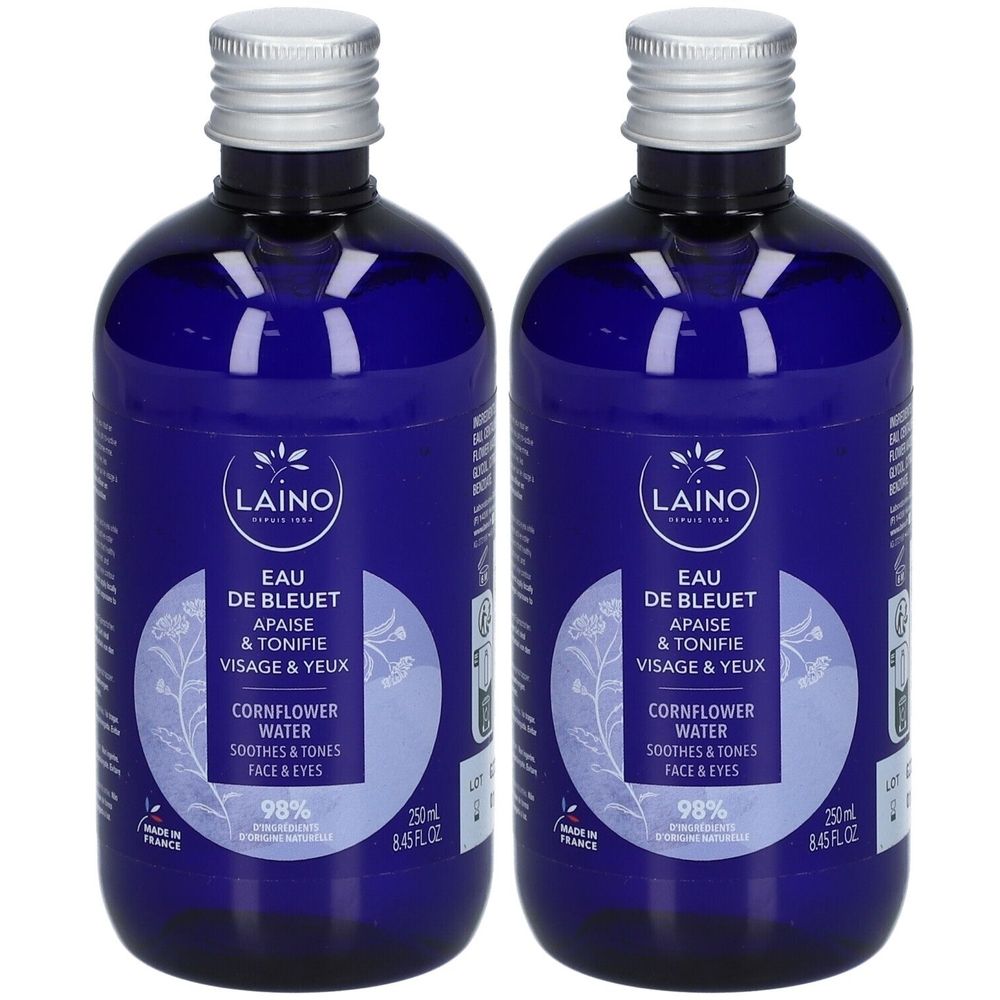 Deux flacons bleus avec bouchons argentés. Inscription: LAINO Eau de Bleuet, apaise et tonifie visage et yeux. Eau de bleuet.