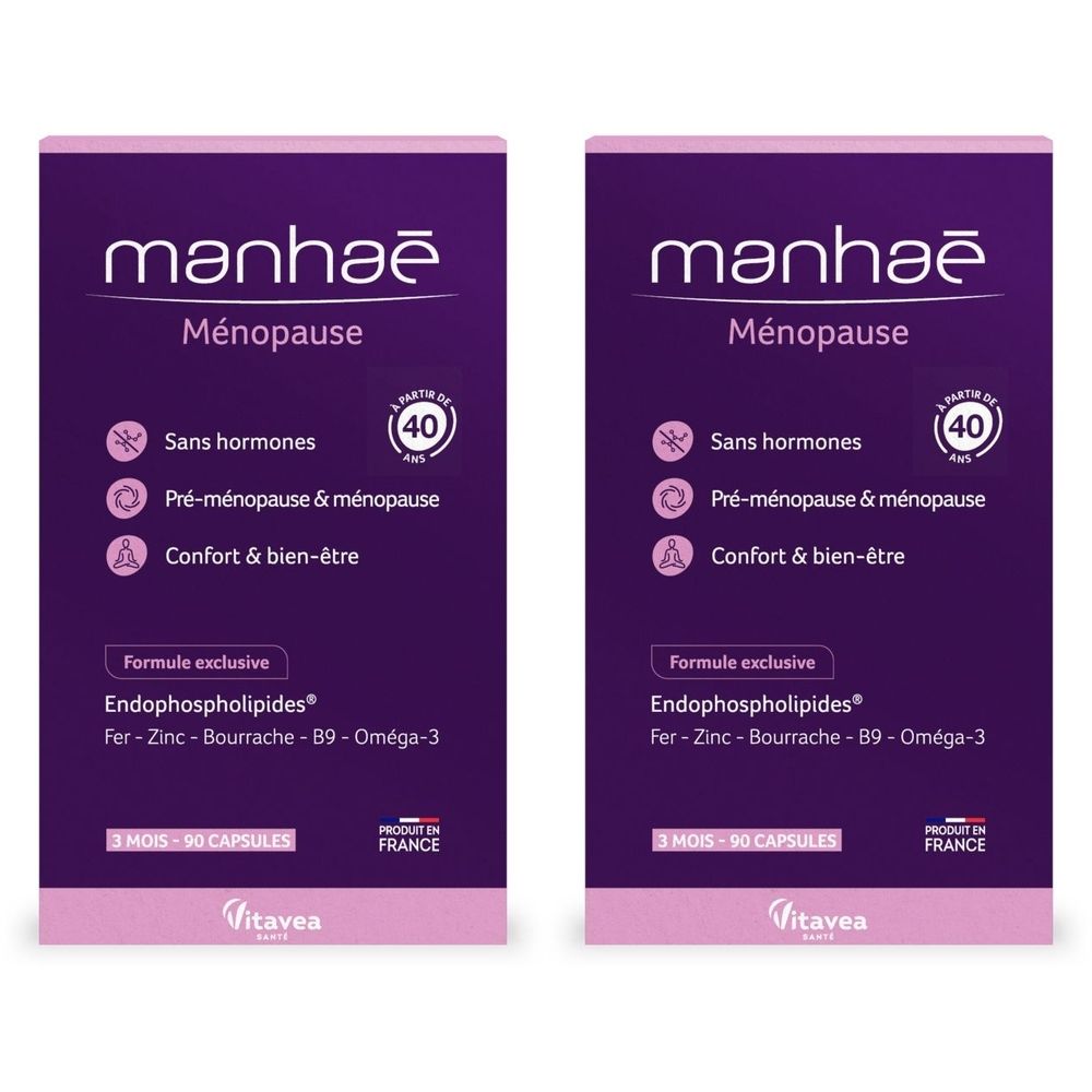 Deux boîtes de Manhaé, compléments alimentaires pour la ménopause. Emballage violet avec texte blanc et rose. Contient 90 gélules.