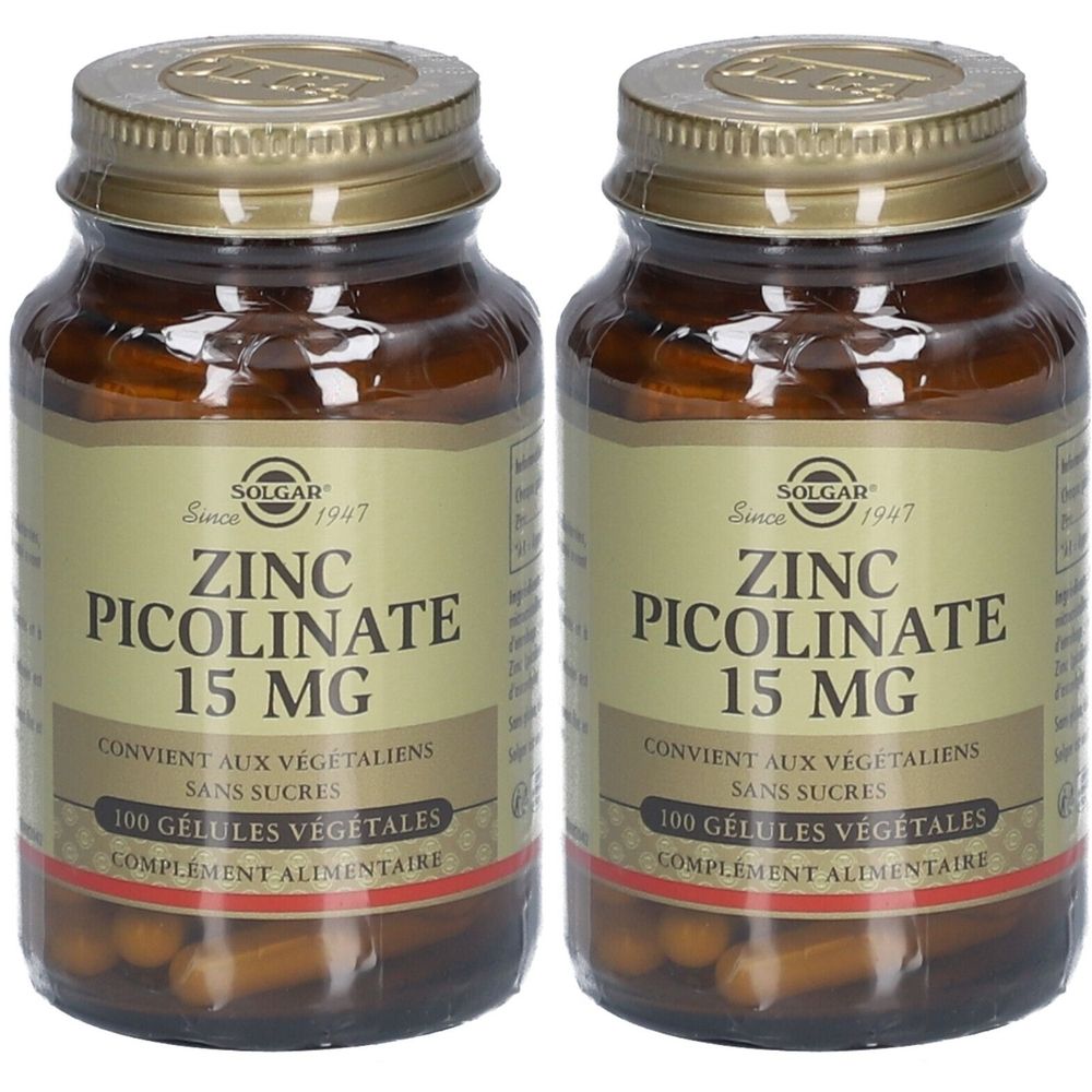 Deux flacons de Solgar Zinc Picolinate 15 mg. Flacons en verre brun avec couvercles dorés et étiquettes. Inscription : Zinc Picolinate 15 mg.