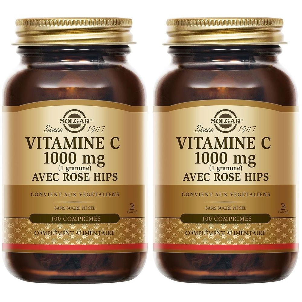 Deux flacons en verre brun avec des couvercles dorés. L'étiquette indique "VITAMINE C 1000 mg" et "AVEC ROSE HIPS". Marque : Solgar.