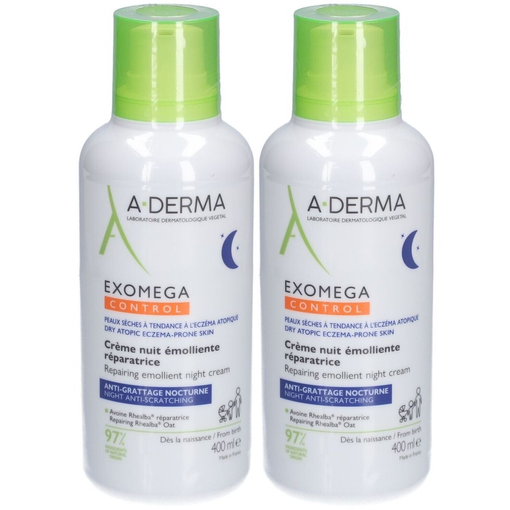 Deux flacons de A-Derma Exomega Control Crème Nuit Emolliente Réparatrice. Flacons blancs avec bouchon vert. Texte: EXOMEGA CONTROL, Crème nuit émolliente.