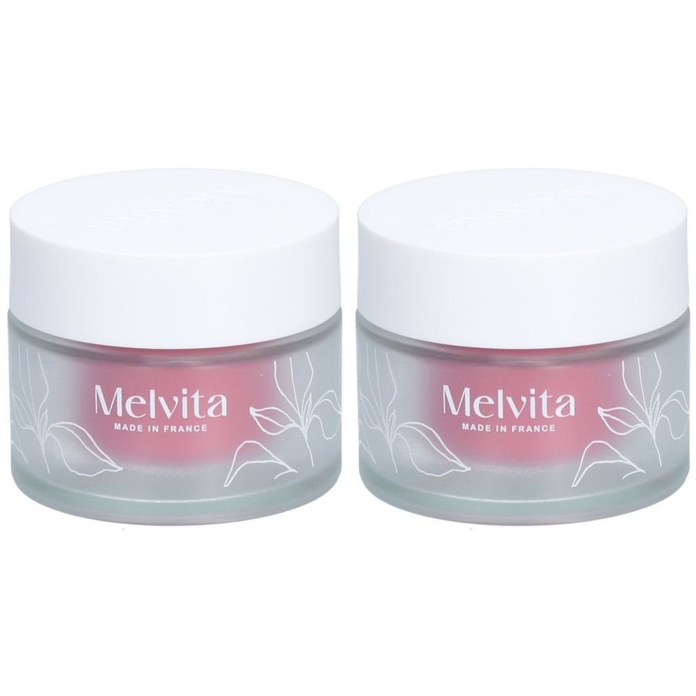 Deux pots avec couvercles blancs. Le nom "Melvita" et "Made in France" sont visibles.