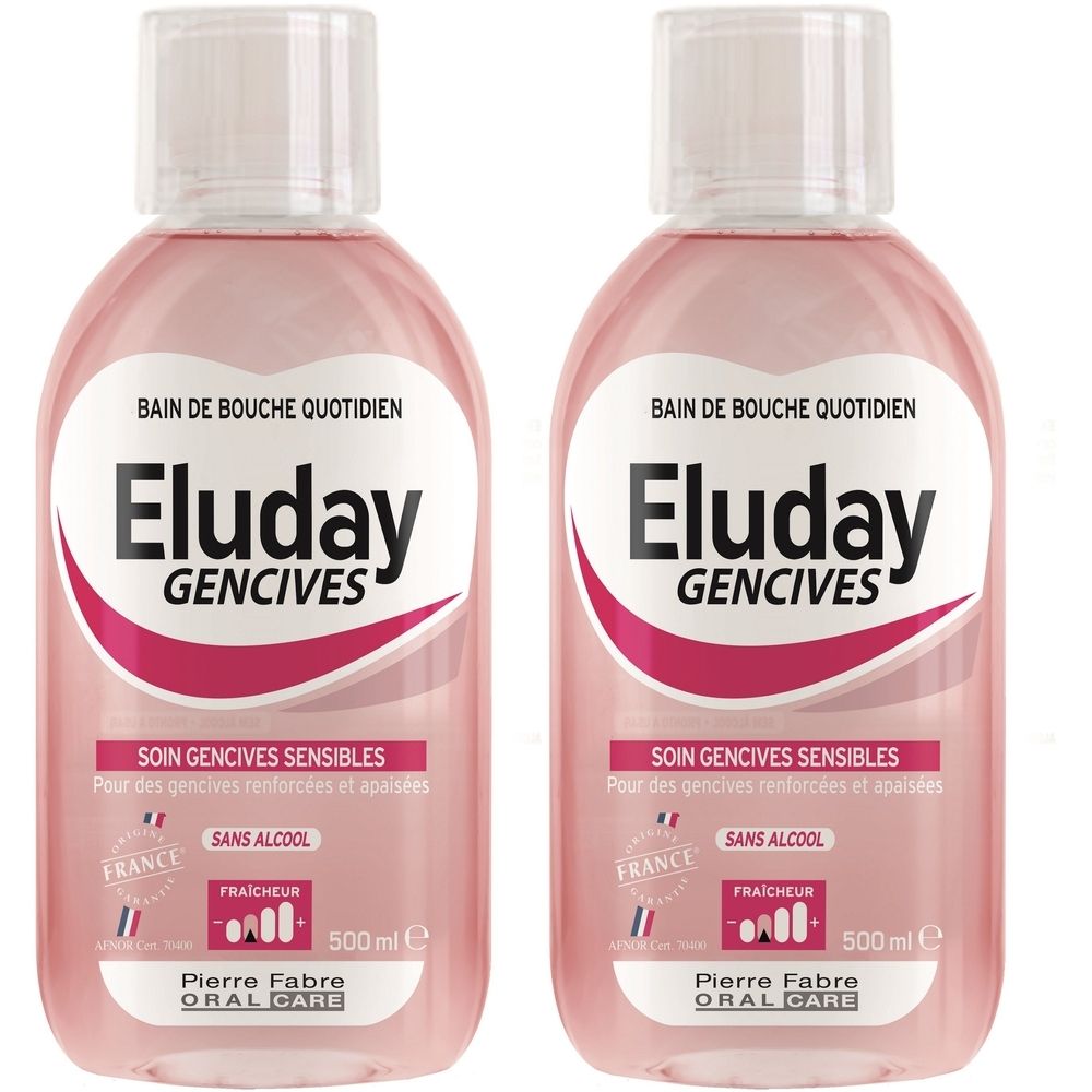 Deux flacons de bain de bouche. Liquide rose, bouchon blanc. Inscription: Eluday Gencives, Soin Gencives Sensibles, Sans Alcool, 500 ml.