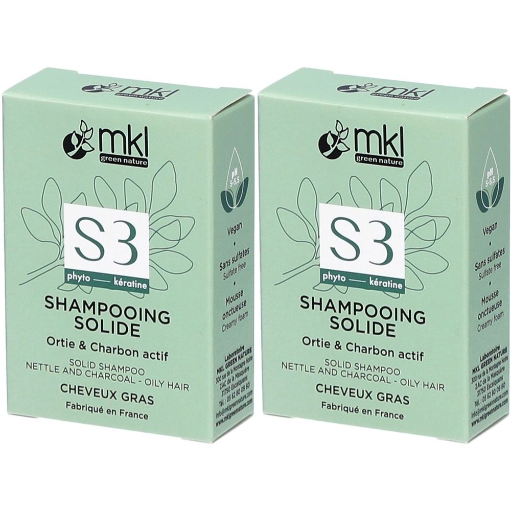 Deux boîtes vertes de shampooing solide MKL. Inscriptions : "Ortie & Charbon actif", "S3 phyto-kératine", "Cheveux Gras". Fabriqué en France.