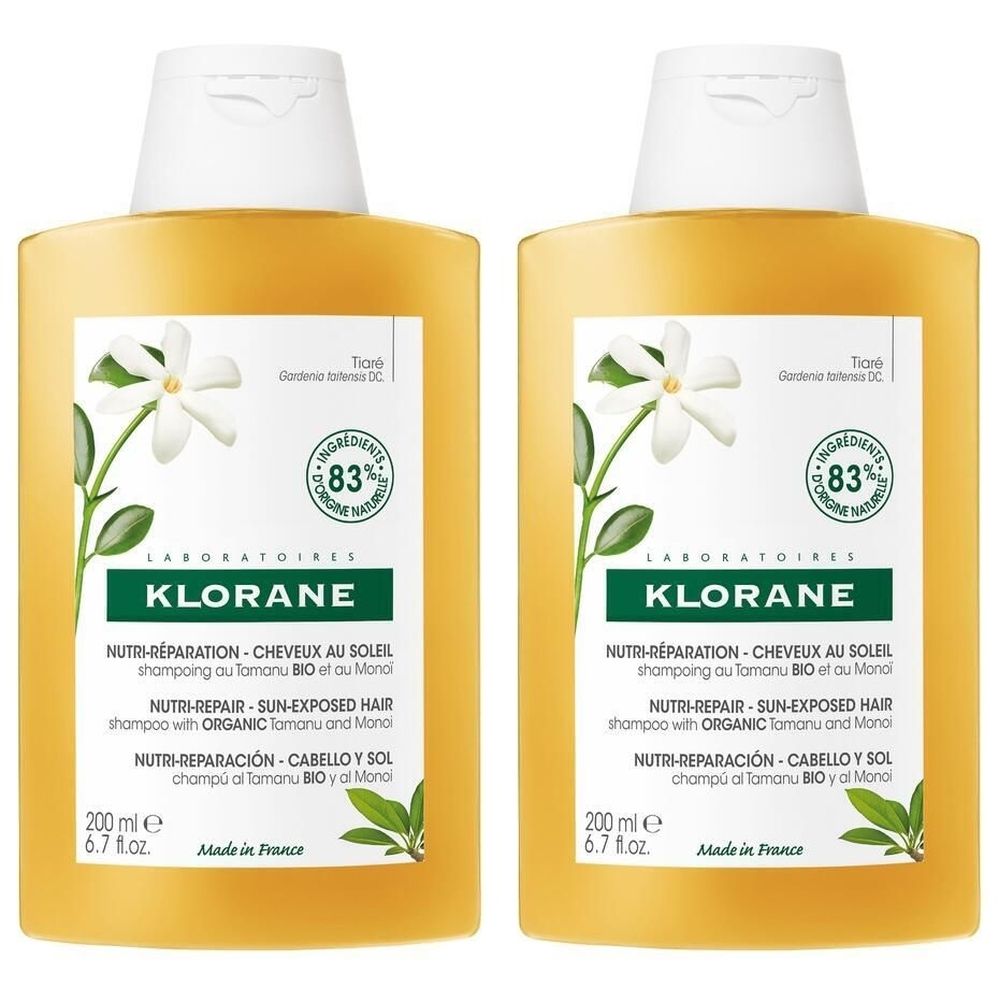 Deux flacons de shampooing jaunes. Inscription: KLORANE, Nutri-Réparation, 83% ingrédients naturels. Décor floral.