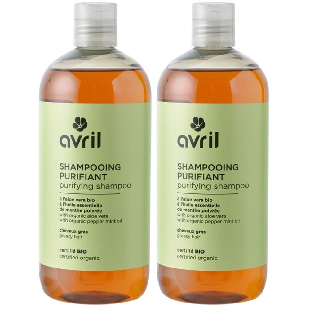 Deux flacons de shampooing purifiant Avril. Étiquettes vert-brun avec informations produit et certification bio.