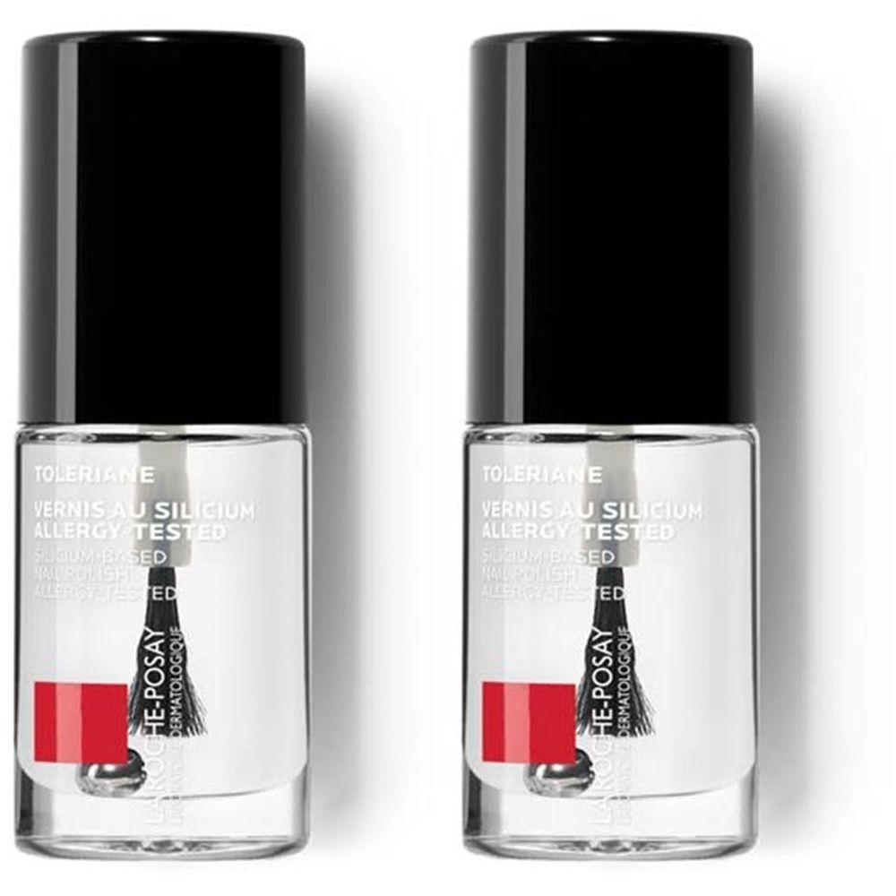 Deux flacons de vernis à ongles avec bouchon noir. Inscription: Toleriane Vernis au Silicium Allergy Tested. Bande rouge avec logo.