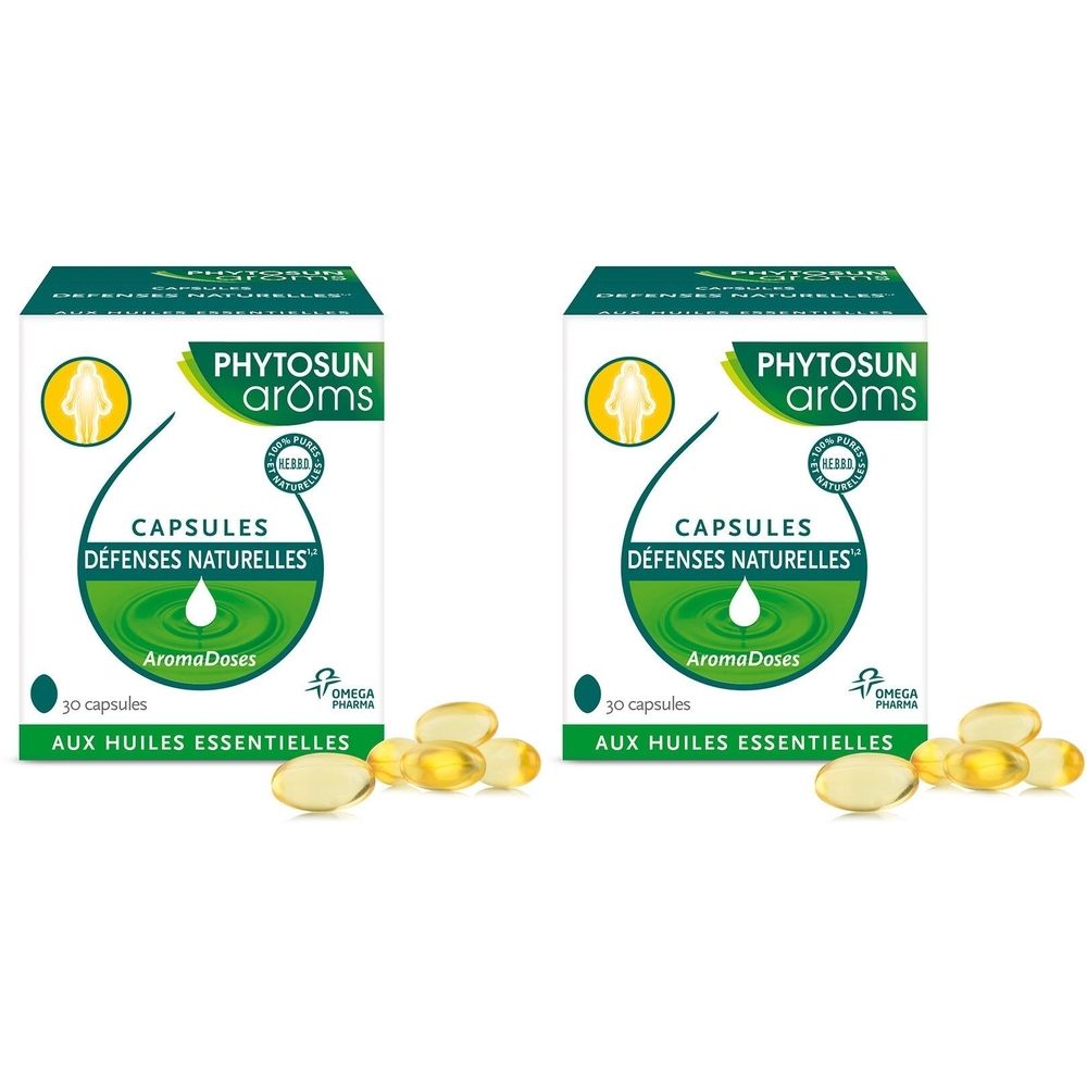 Deux boîtes de capsules. Inscription: PHYTOSUN arôms, CAPSULES DÉFENSES NATURELLES, 30 capsules, AUX HUILES ESSENTIELLES. Quelques gélules sont devant.