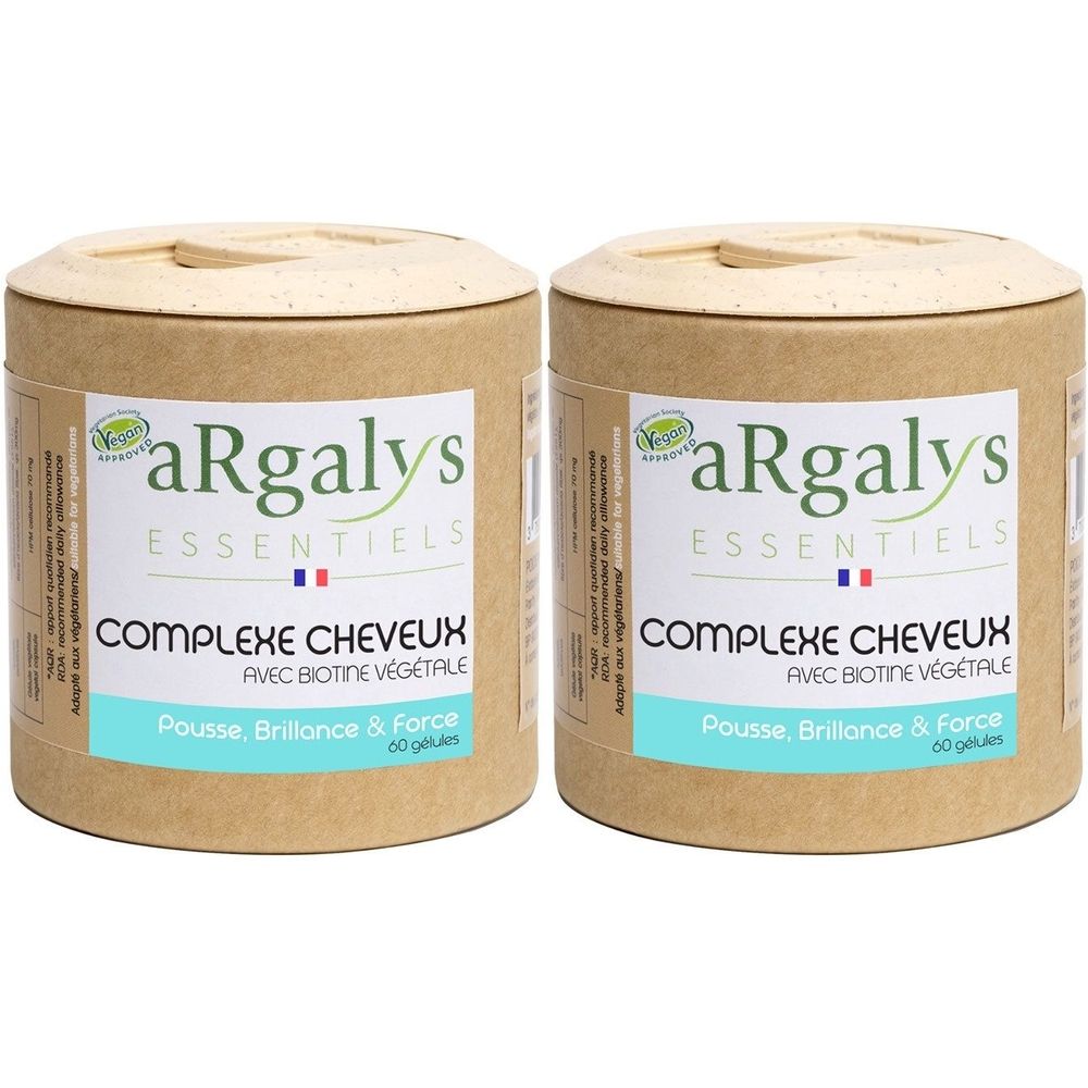 Deux boîtes cylindriques avec couvercles. Inscription: Argalys, Complexe Cheveux, avec biotine végétale. Label vegan. Drapeau français.