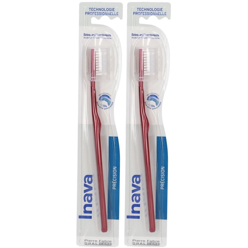 Deux brosses à dents rouges sous blister. Marque Inava, avec l'inscription "PRÉCISION".